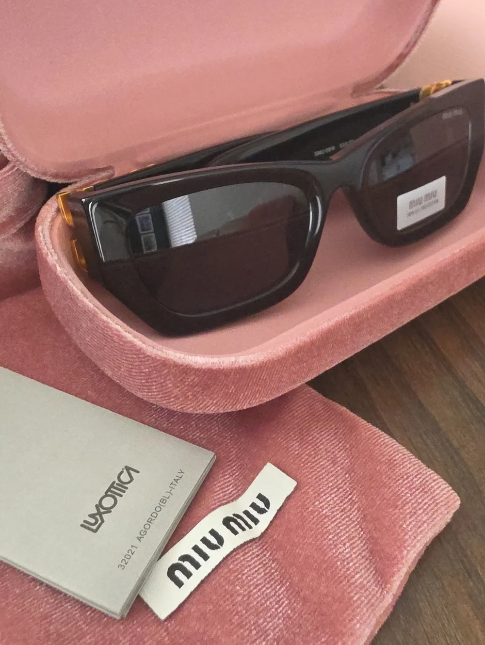 Miu Miu Glossy Black Cat-Eye Sunglasses with Pink Velvet Case